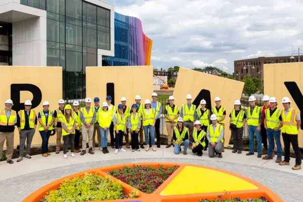 Interns and mentors in front of the museum