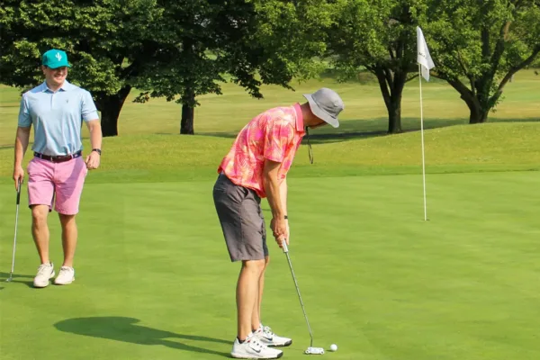 LeChase team member golfing