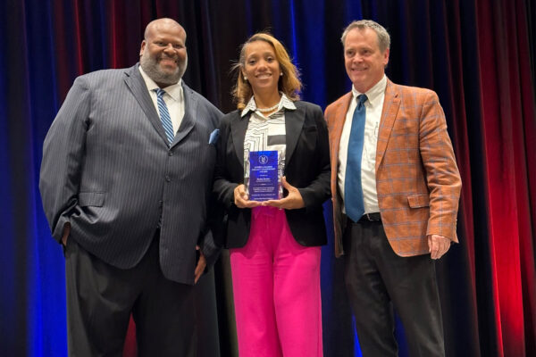 Denise accepting her award at Durham MED Week