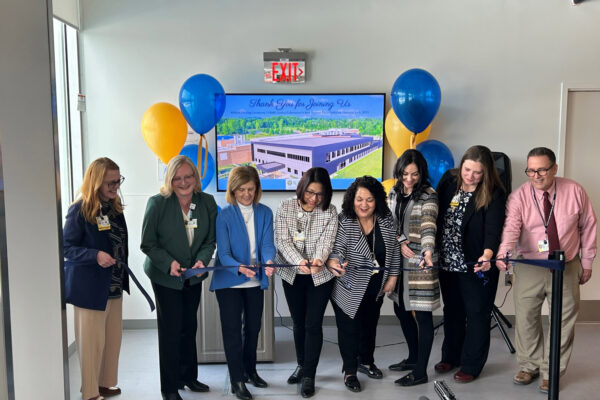 Team cutting the ribbon at the Bailey Road Expansion